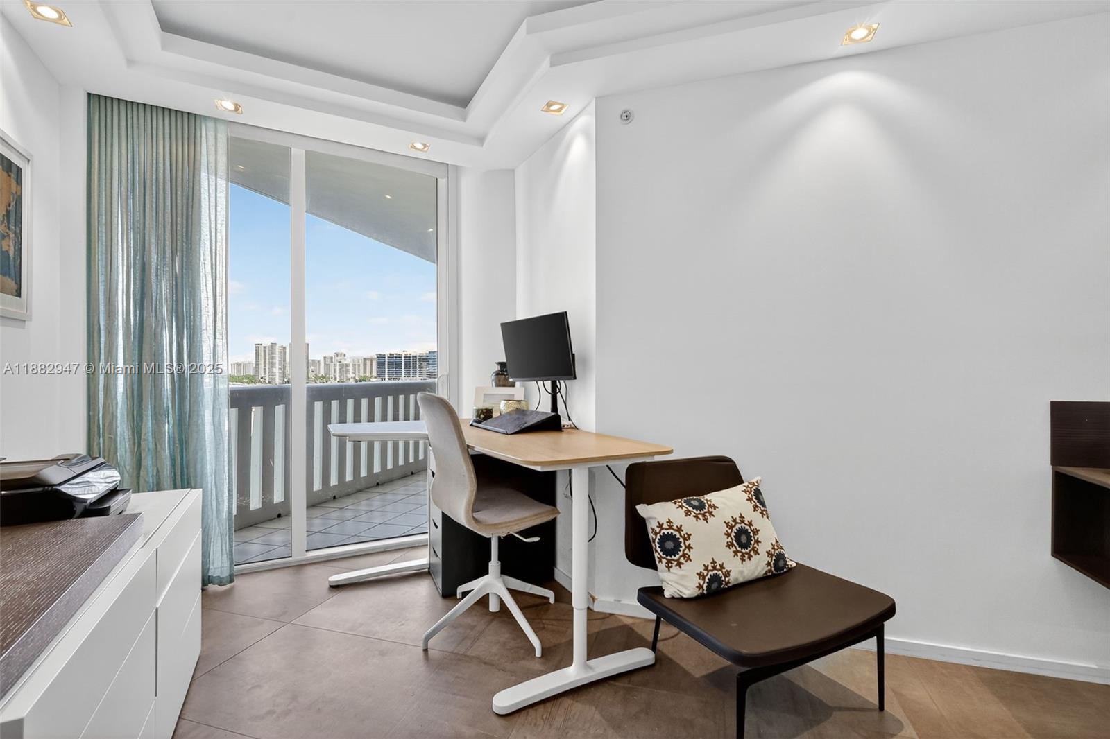 3000 Island Boulevard, Unit 906 Aventura, FL 33160 - Photo 43 of 58 a workspace with furniture and a window