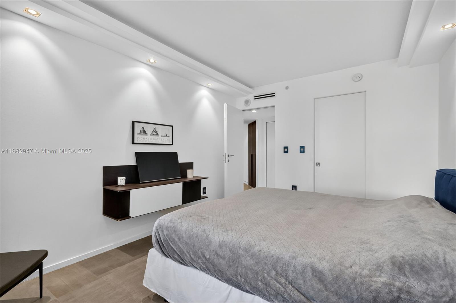 3000 Island Boulevard, Unit 906 Aventura, FL 33160 - Photo 44 of 58 a large white bed in a white room