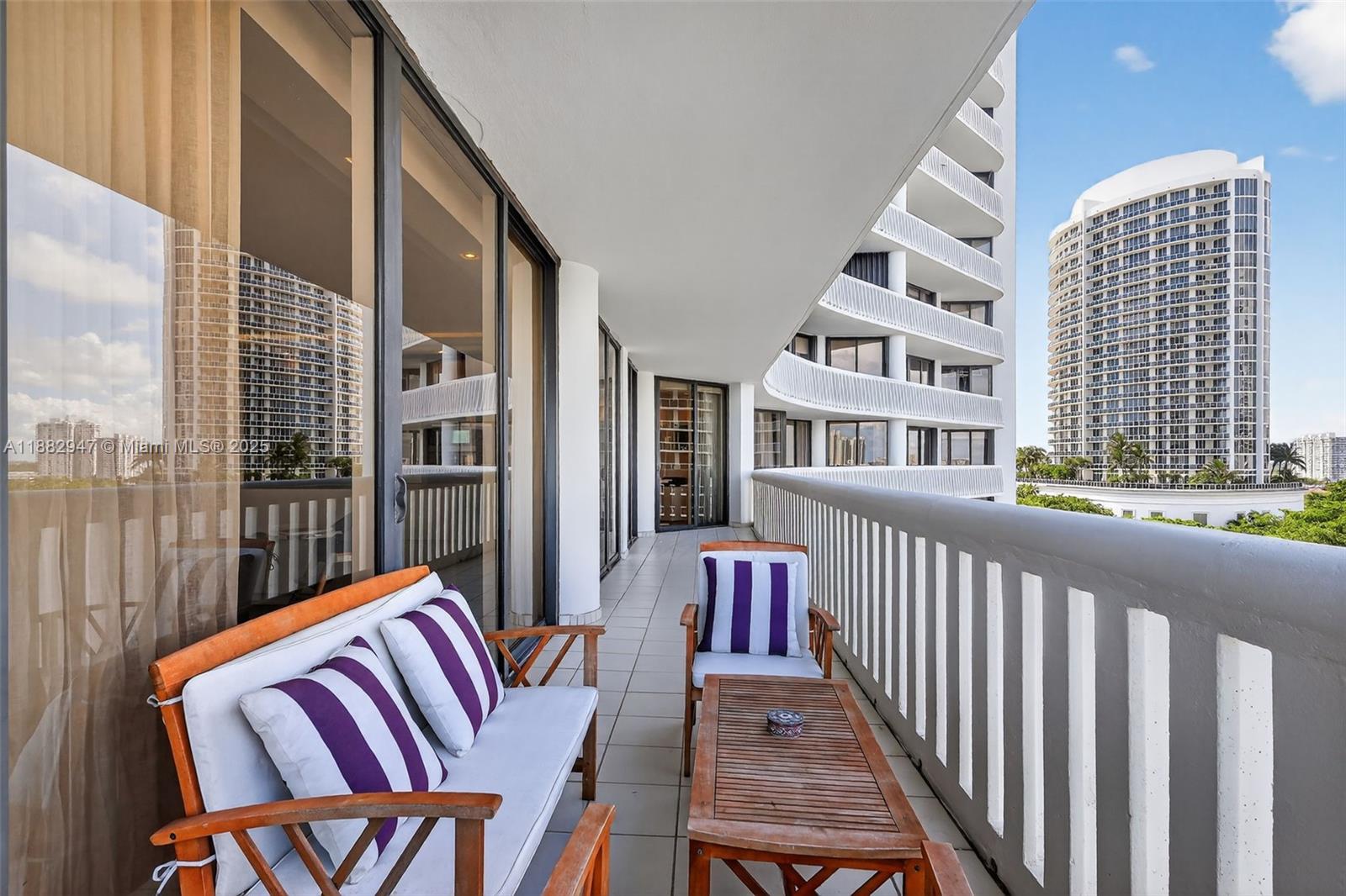 3000 Island Boulevard, Unit 906 Aventura, FL 33160 - Photo 49 of 58 a view of a balcony with furniture