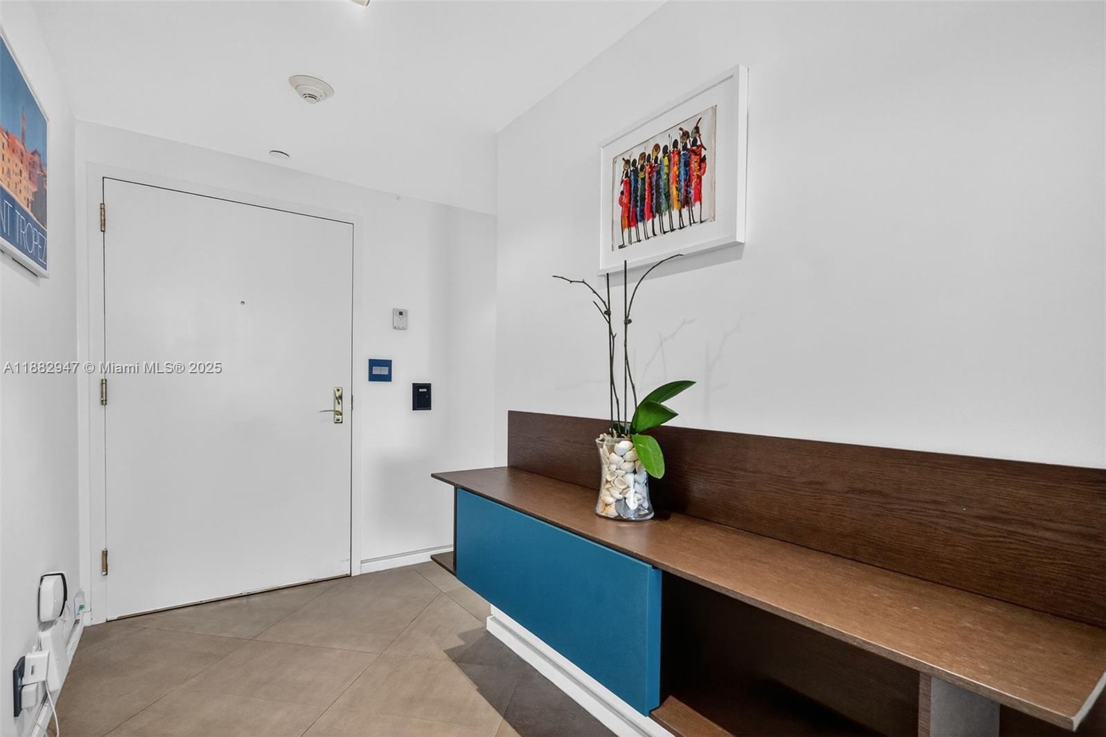 3000 Island Boulevard, Unit 906 Aventura, FL 33160 - Photo 6 of 58 a living room with furniture and a potted plant