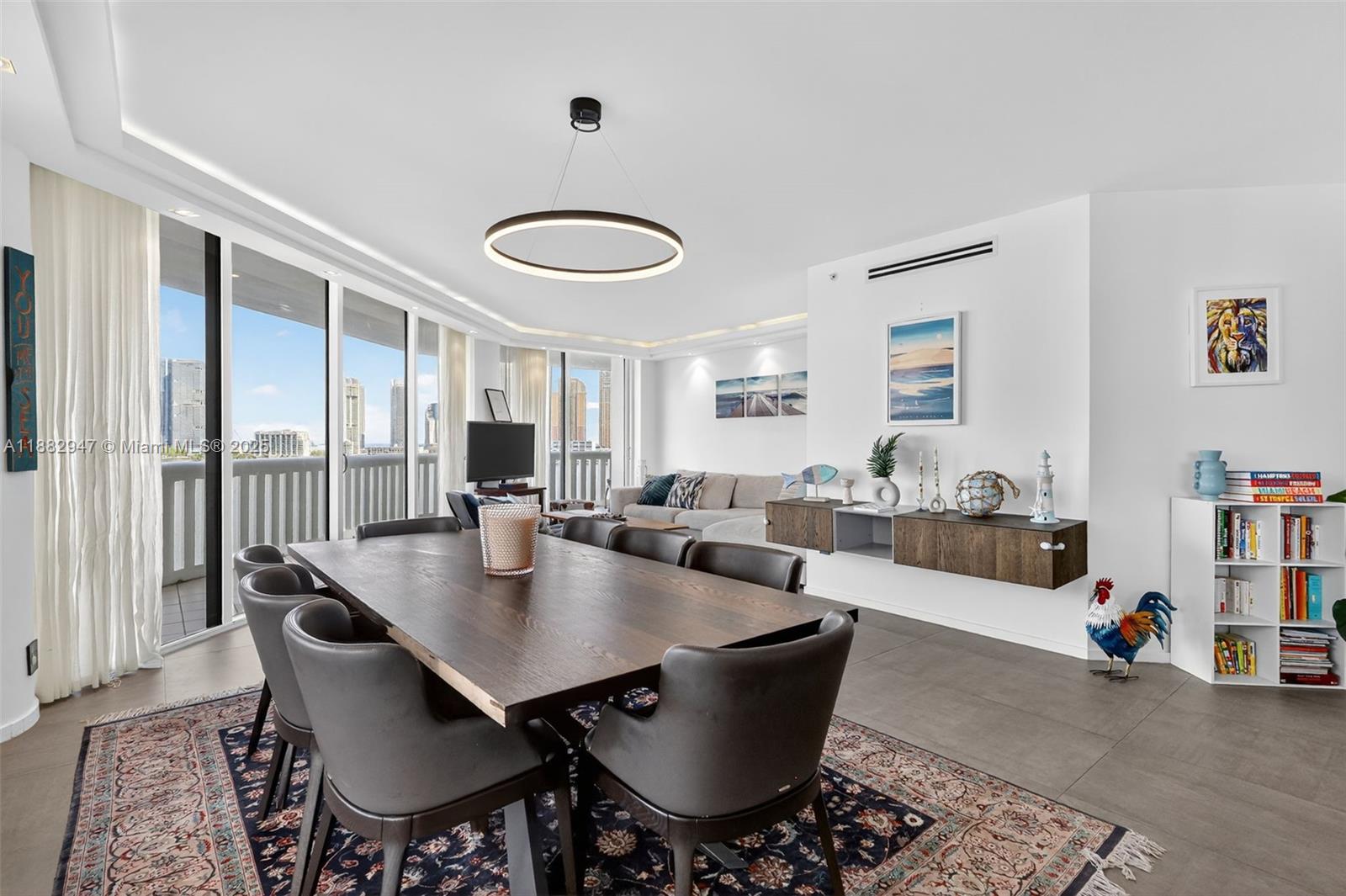 3000 Island Boulevard, Unit 906 Aventura, FL 33160 - Photo 8 of 58 a view of a dining room and livingroom with furniture