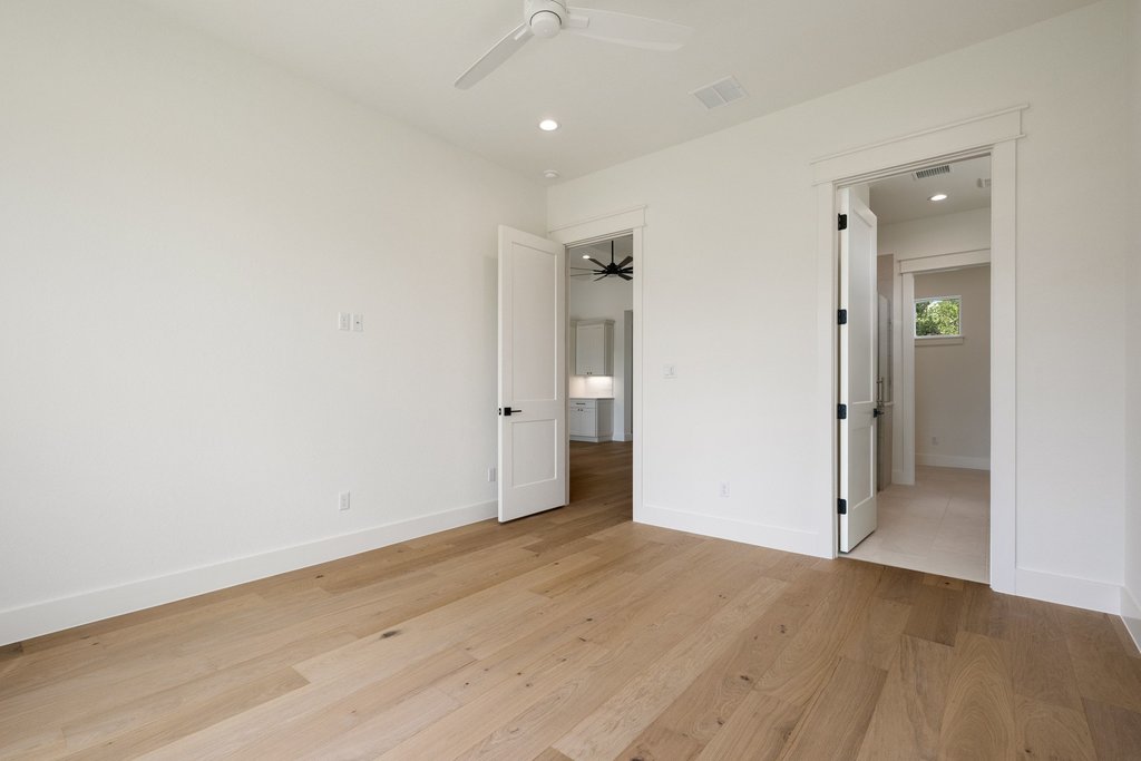 501 Ranchview Drive Johnson City, TX 78636 - Photo 16 of 28 an empty room with wooden floor and entrance