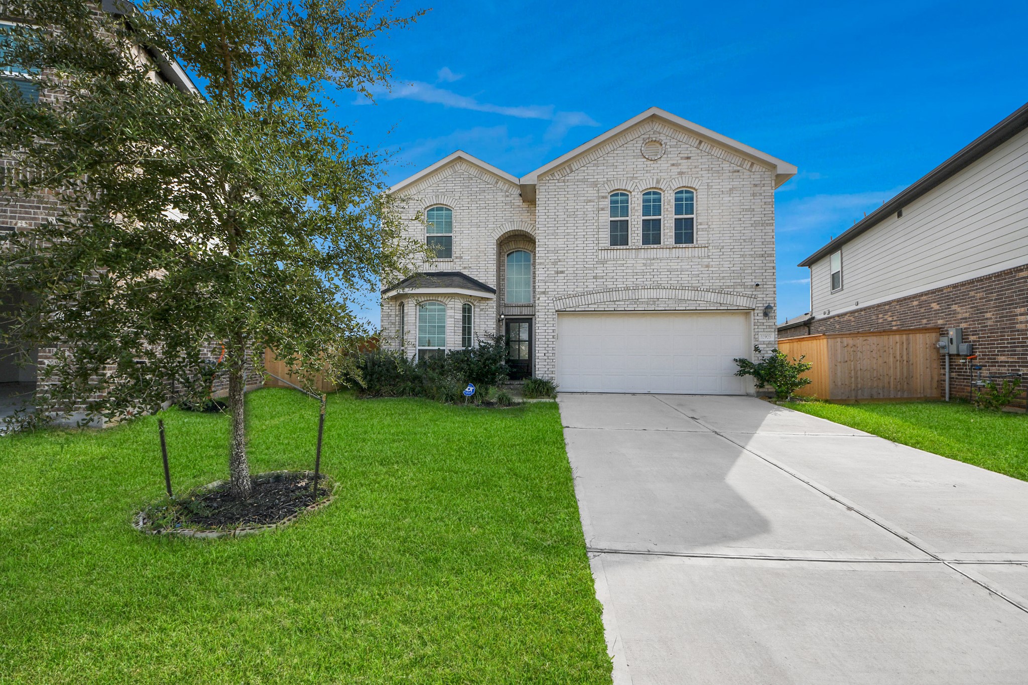 32903 Silver Meadow Way Brookshire, TX 77423 - Photo 3 of 40 a front view of a house with a yard and trees