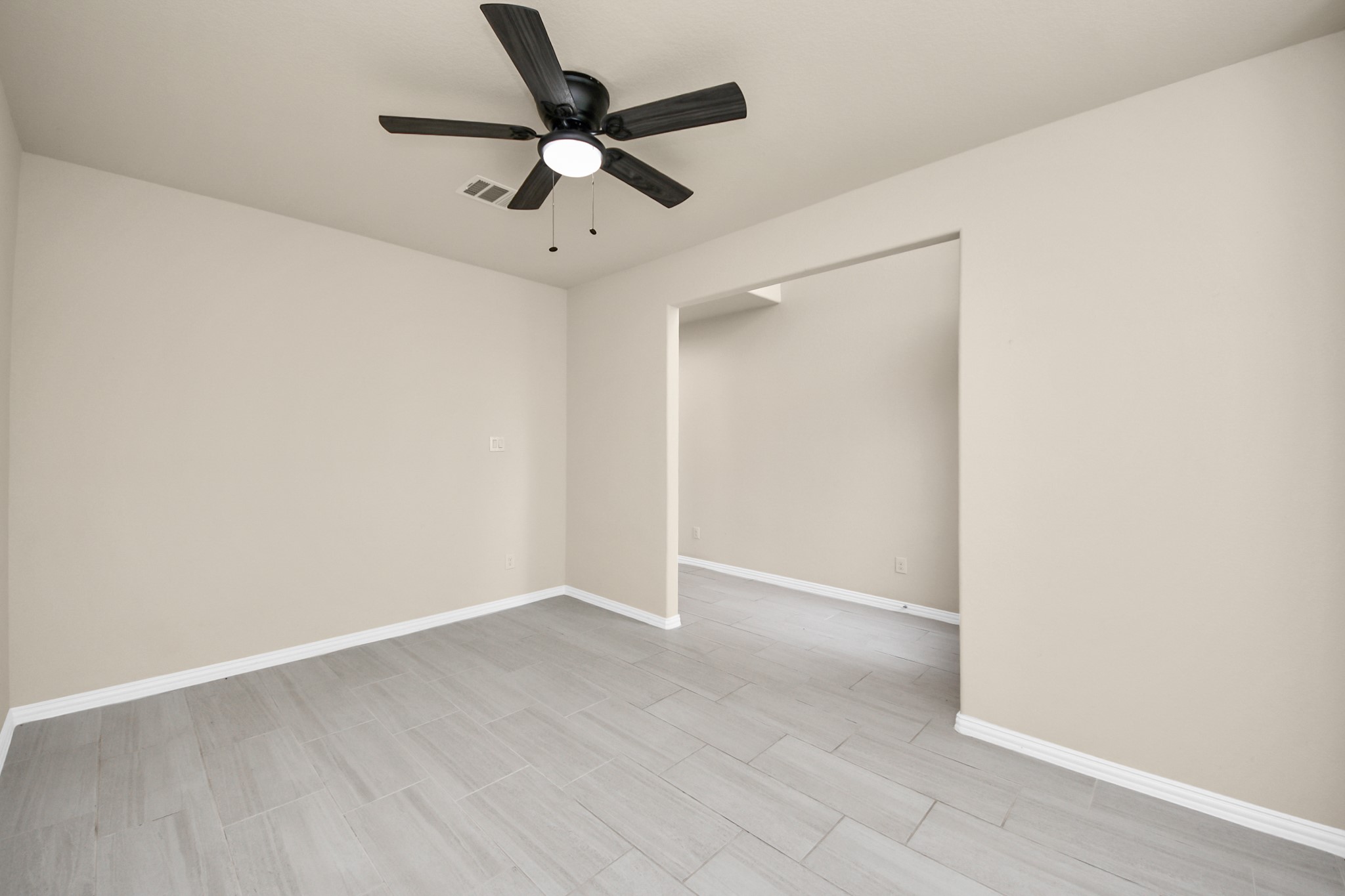 32903 Silver Meadow Way Brookshire, TX 77423 - Photo 34 of 40 an empty room with wooden floor and ceiling fan