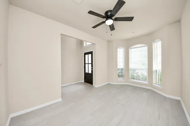 a view of an empty room with a window