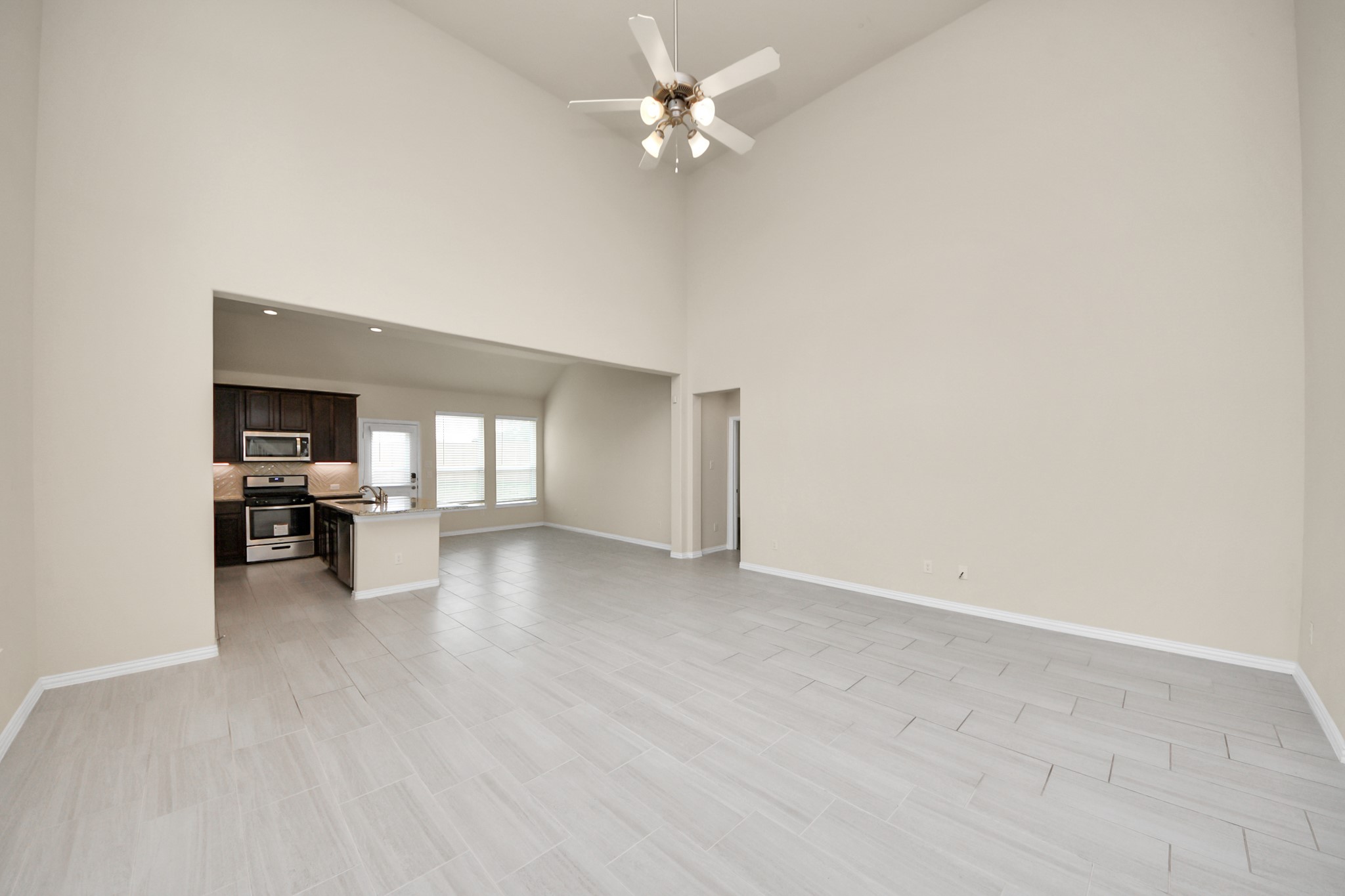 32903 Silver Meadow Way Brookshire, TX 77423 - Photo 8 of 40 an empty room with fireplace and a ceiling fan