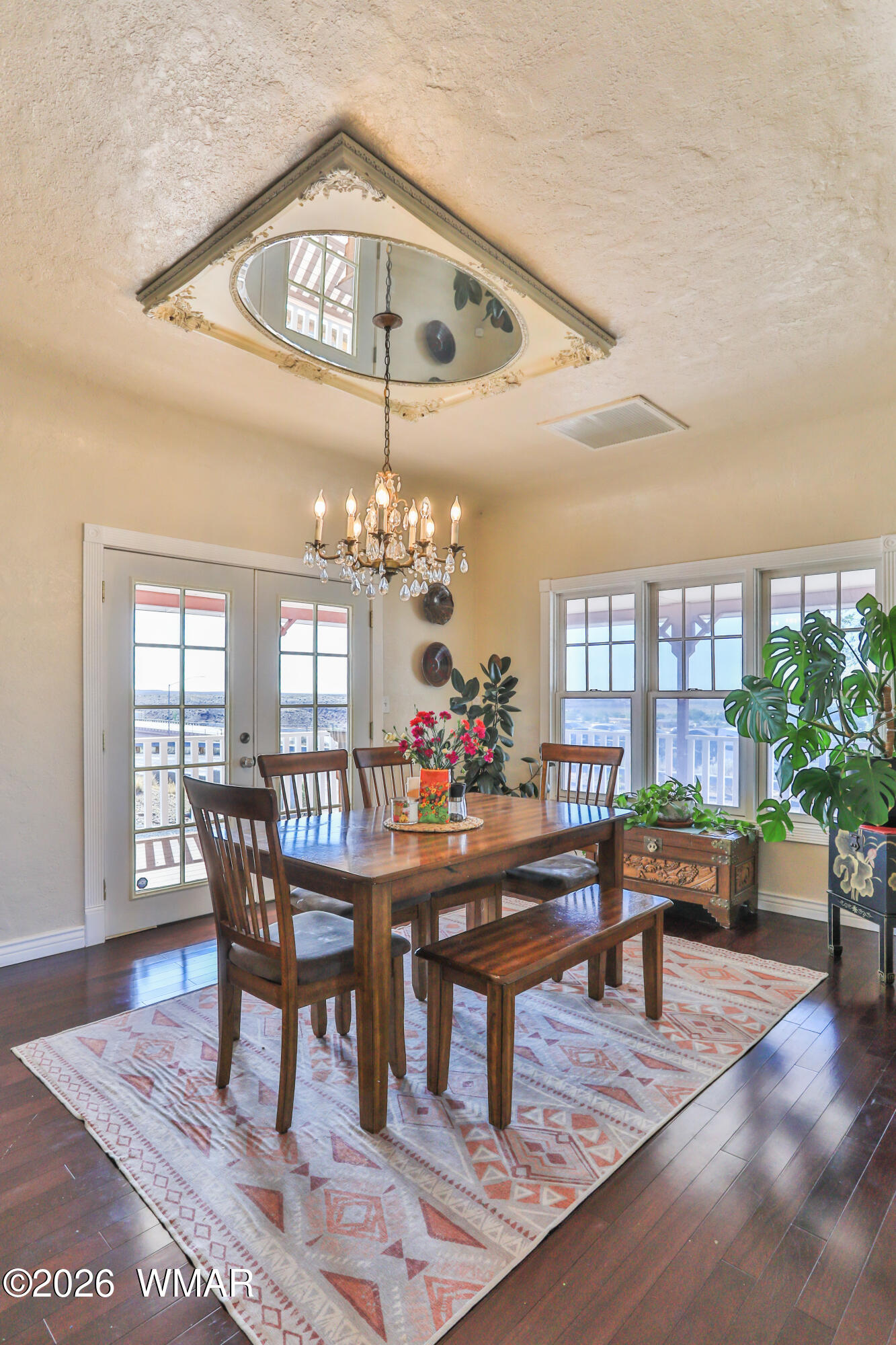 102 Crestview Road Holbrook, AZ 86025 - Photo 14 of 55 a view of a dining room with furniture window and wooden floor