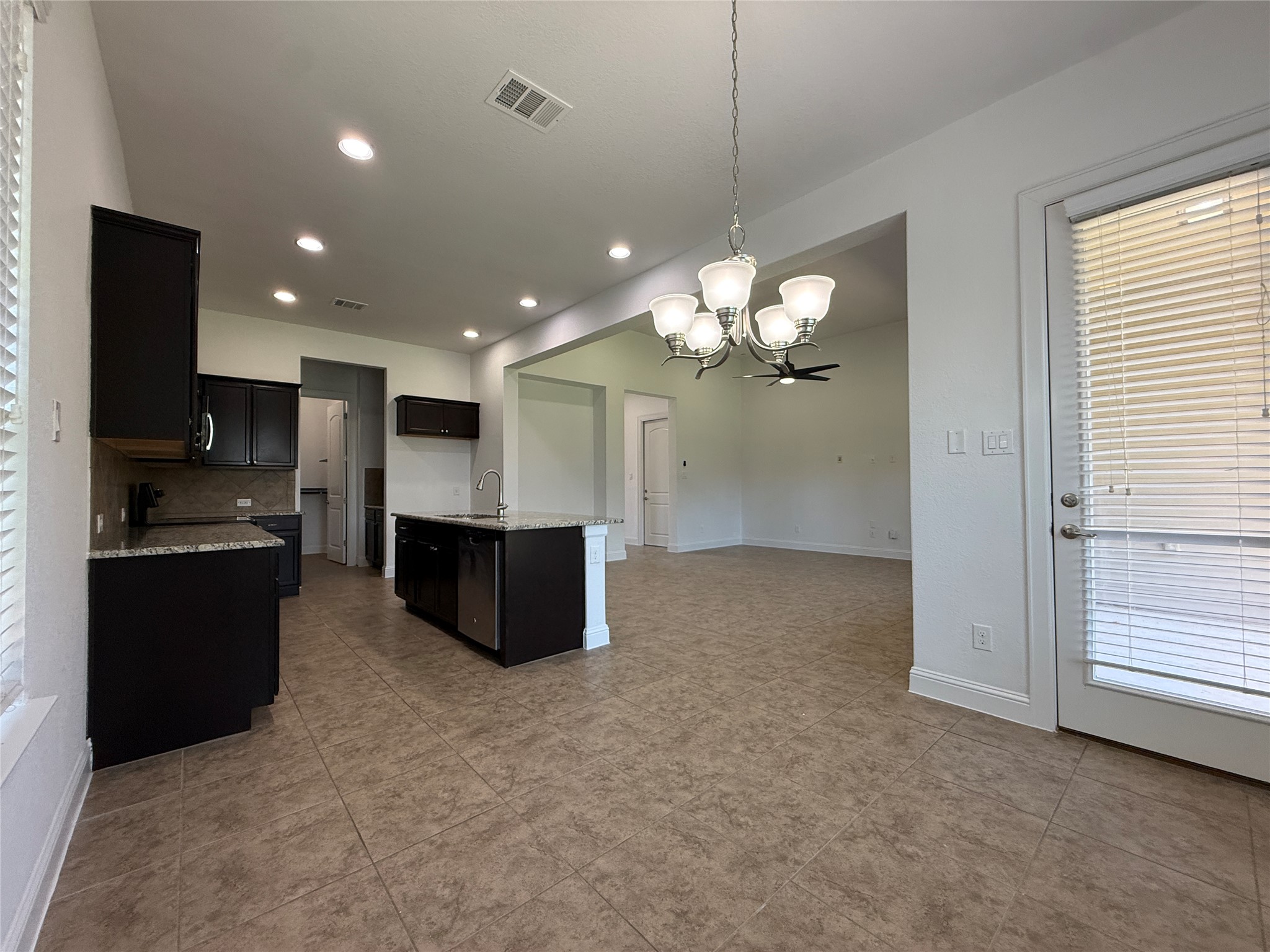 1512 Long Shadow Lane Georgetown, TX 78628 - Photo 8 of 19 a large kitchen with a refrigerator a stove top oven a sink and dishwasher
