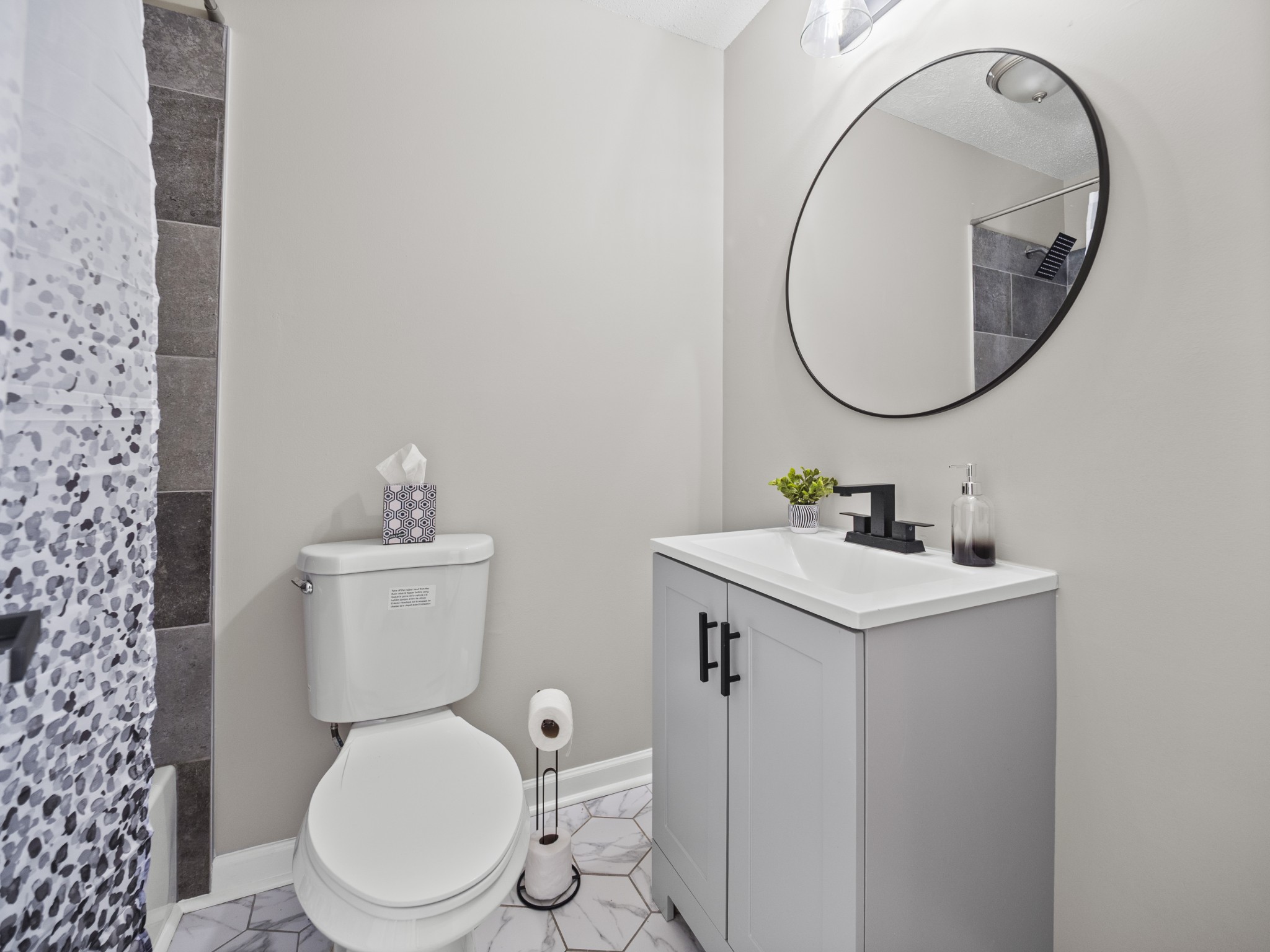 1883 Needmore Road Clarksville, TN 37042 - Photo 11 of 25 a bathroom with a toilet a sink and a mirror