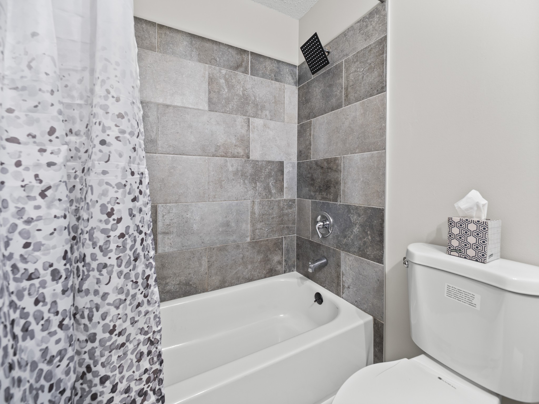 1883 Needmore Road Clarksville, TN 37042 - Photo 15 of 25 a bathroom with a toilet and a bathtub