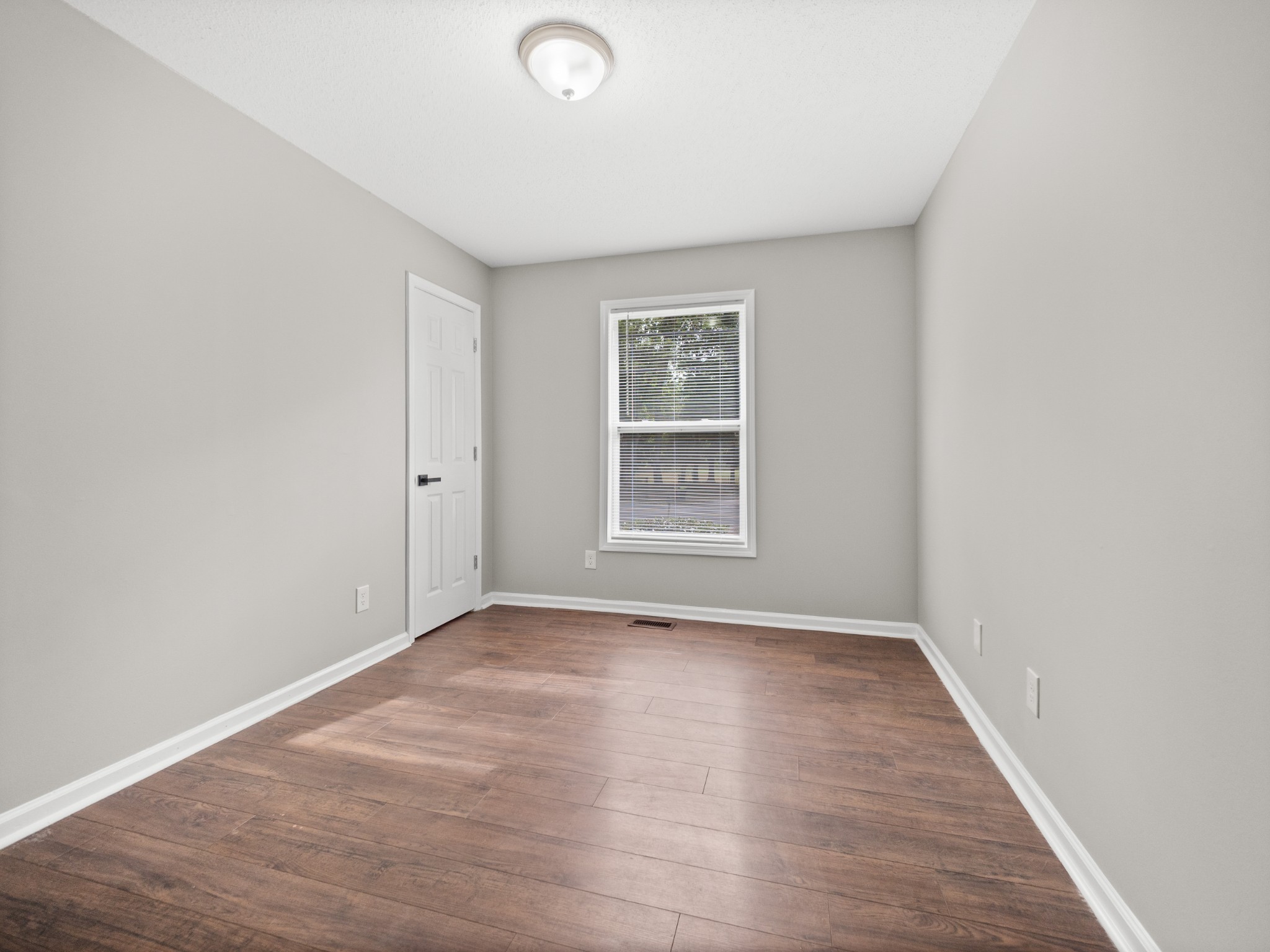 1883 Needmore Road Clarksville, TN 37042 - Photo 8 of 25 wooden floor in an empty room