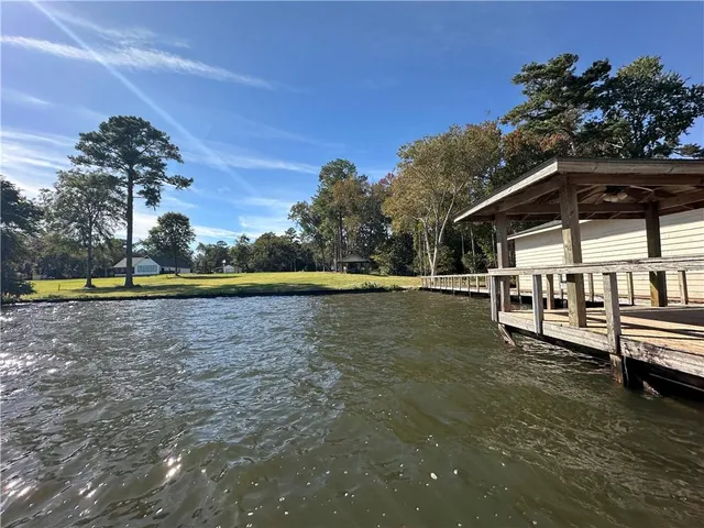 a view of a house with a yard from a balcony