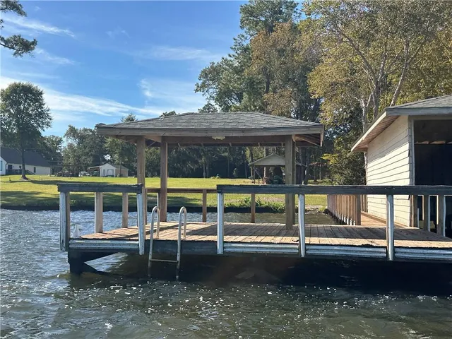 a view of a swimming pool with a bench