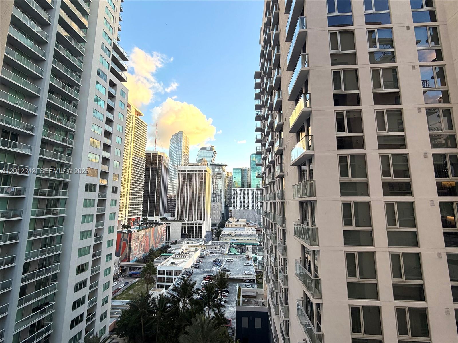 234 Northeast 3rd Street, Unit 1908 Miami, FL 33132 - Photo 15 of 16 a view of a city with tall buildings