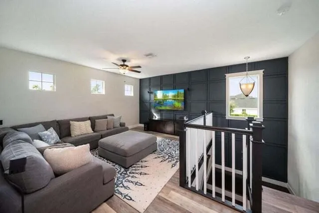 a living room with furniture and a flat screen tv