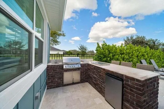 a view of a house with porch and furniture