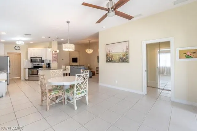 a dining room with furniture and a view of kitchen