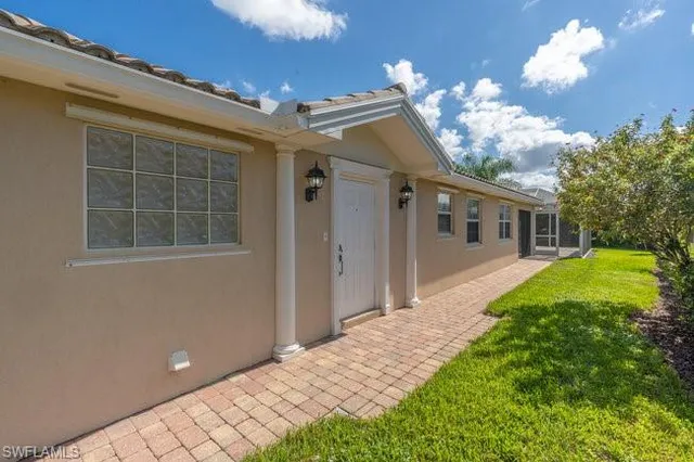 a front view of a house with garden