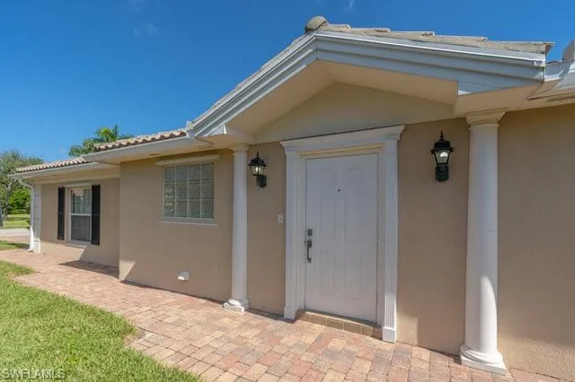 a view of a house with a small yard