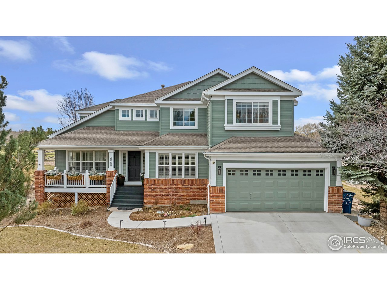 3058 West 111th Drive Westminster, CO 80031 - Photo 1 of 39 a front view of a house with a yard and garage