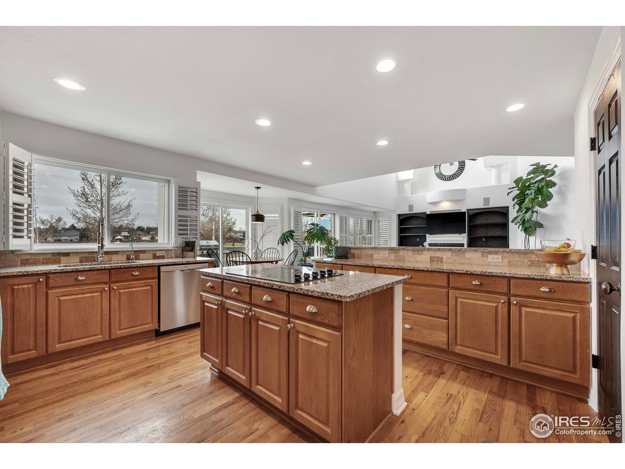 3058 West 111th Drive Westminster, CO 80031 - Photo 12 of 39 a kitchen with stainless steel appliances granite countertop a sink and cabinets