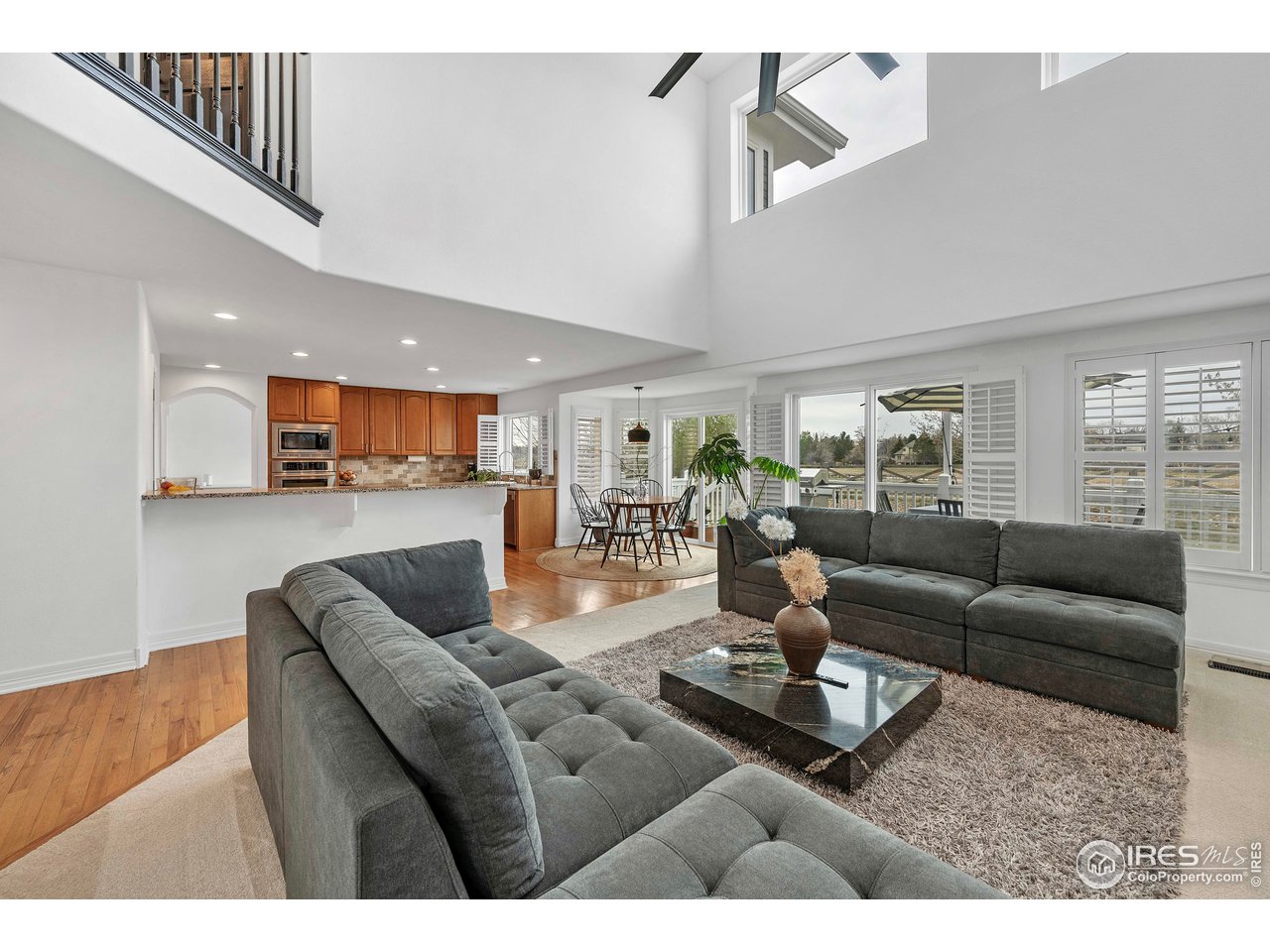 3058 West 111th Drive Westminster, CO 80031 - Photo 15 of 39 a living room with furniture and a wooden floor