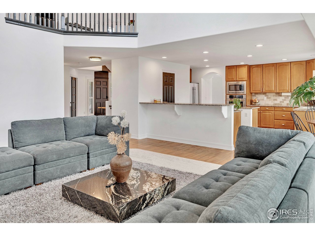 3058 West 111th Drive Westminster, CO 80031 - Photo 16 of 39 a living room with furniture and a wooden floor