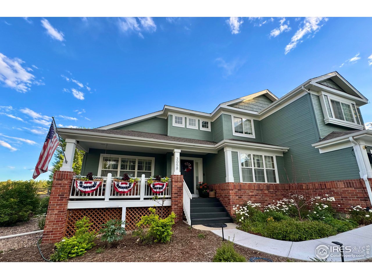 3058 West 111th Drive Westminster, CO 80031 - Photo 2 of 39 a front view of a house with garden