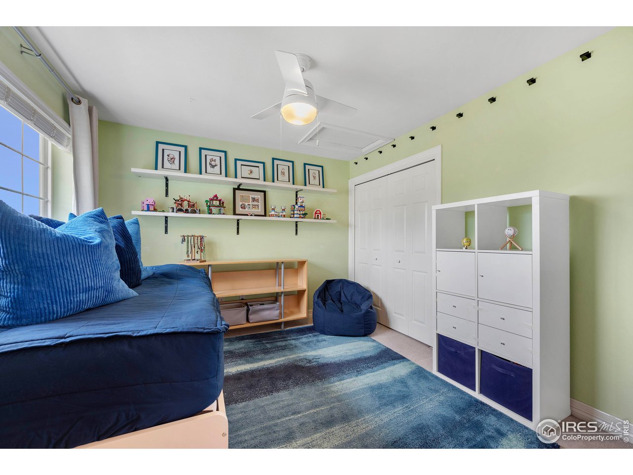 3058 West 111th Drive Westminster, CO 80031 - Photo 21 of 39 a living room with furniture and a table