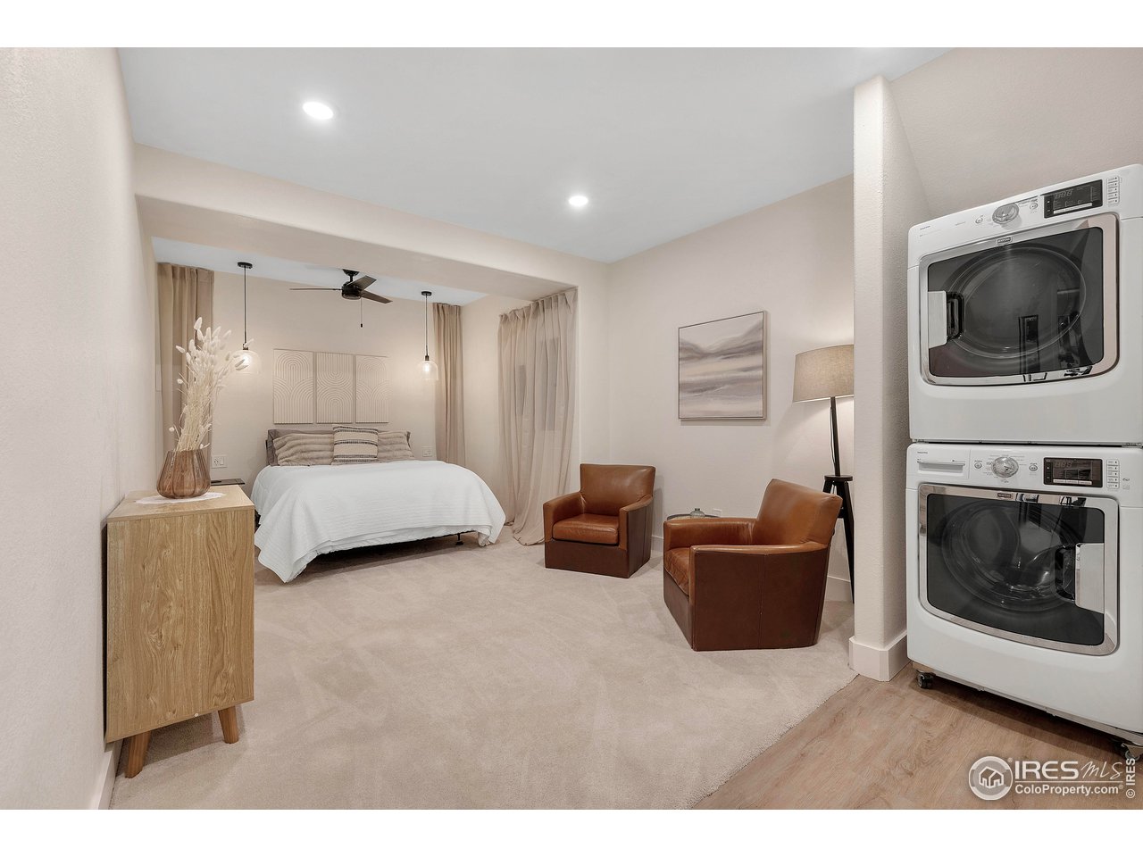 3058 West 111th Drive Westminster, CO 80031 - Photo 25 of 39 a bedroom with furniture and a fireplace