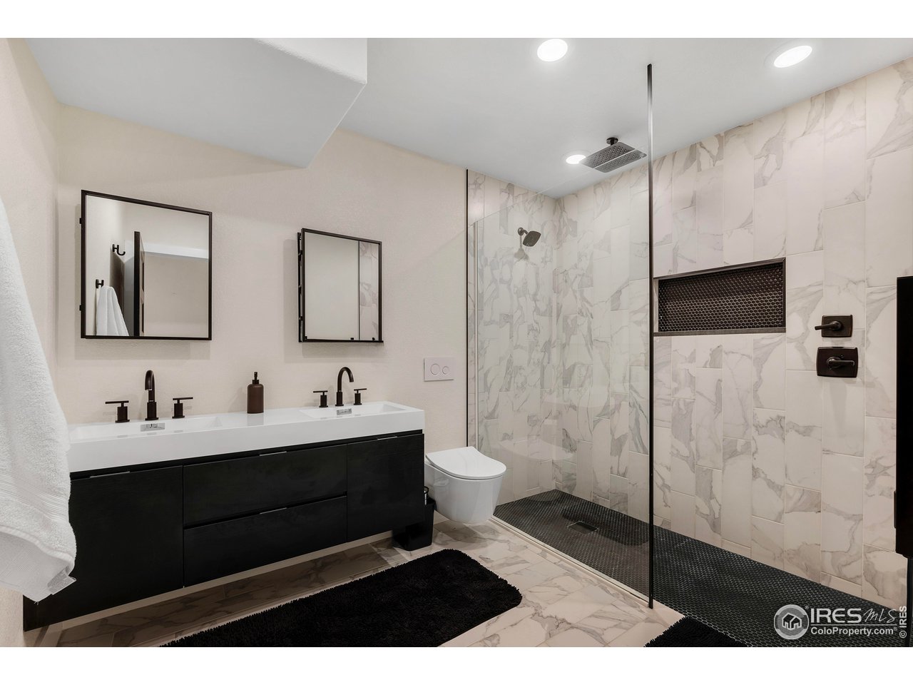 3058 West 111th Drive Westminster, CO 80031 - Photo 26 of 39 a bathroom with a sink and a mirror