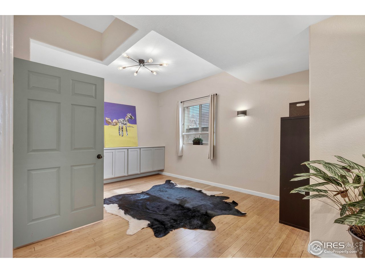 3058 West 111th Drive Westminster, CO 80031 - Photo 29 of 39 a living room with furniture and a rug