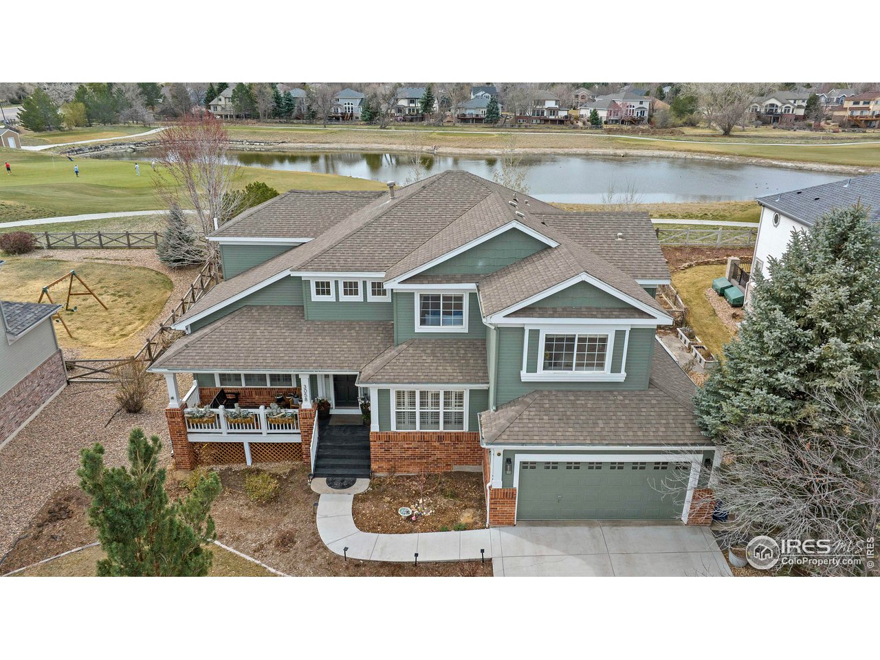 3058 West 111th Drive Westminster, CO 80031 - Photo 34 of 39 a aerial view of a house with a garden and lake view
