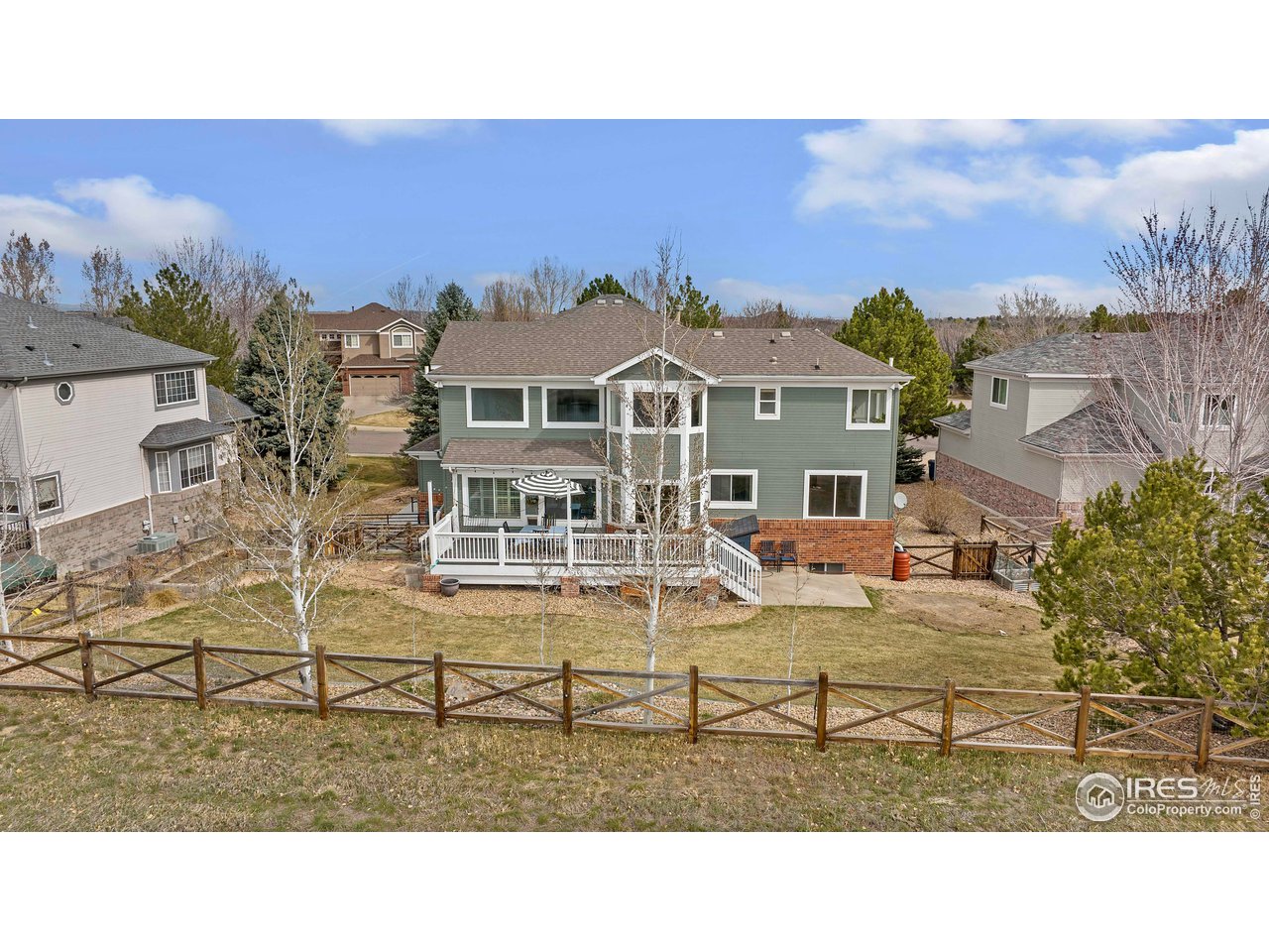 3058 West 111th Drive Westminster, CO 80031 - Photo 38 of 39 a balcony with table and chairs