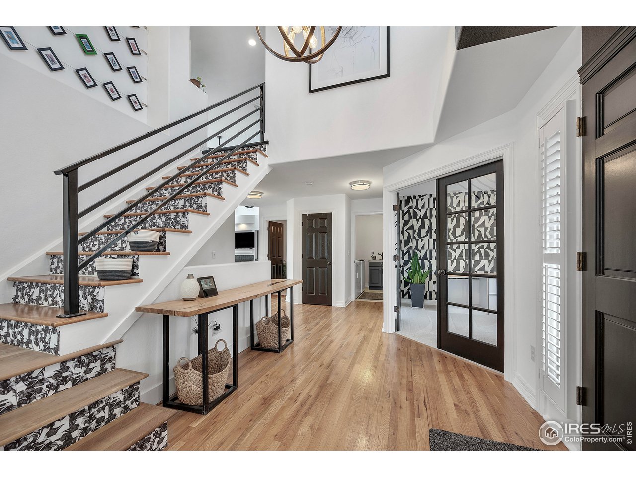 3058 West 111th Drive Westminster, CO 80031 - Photo 4 of 39 a view of entryway with wooden floor
