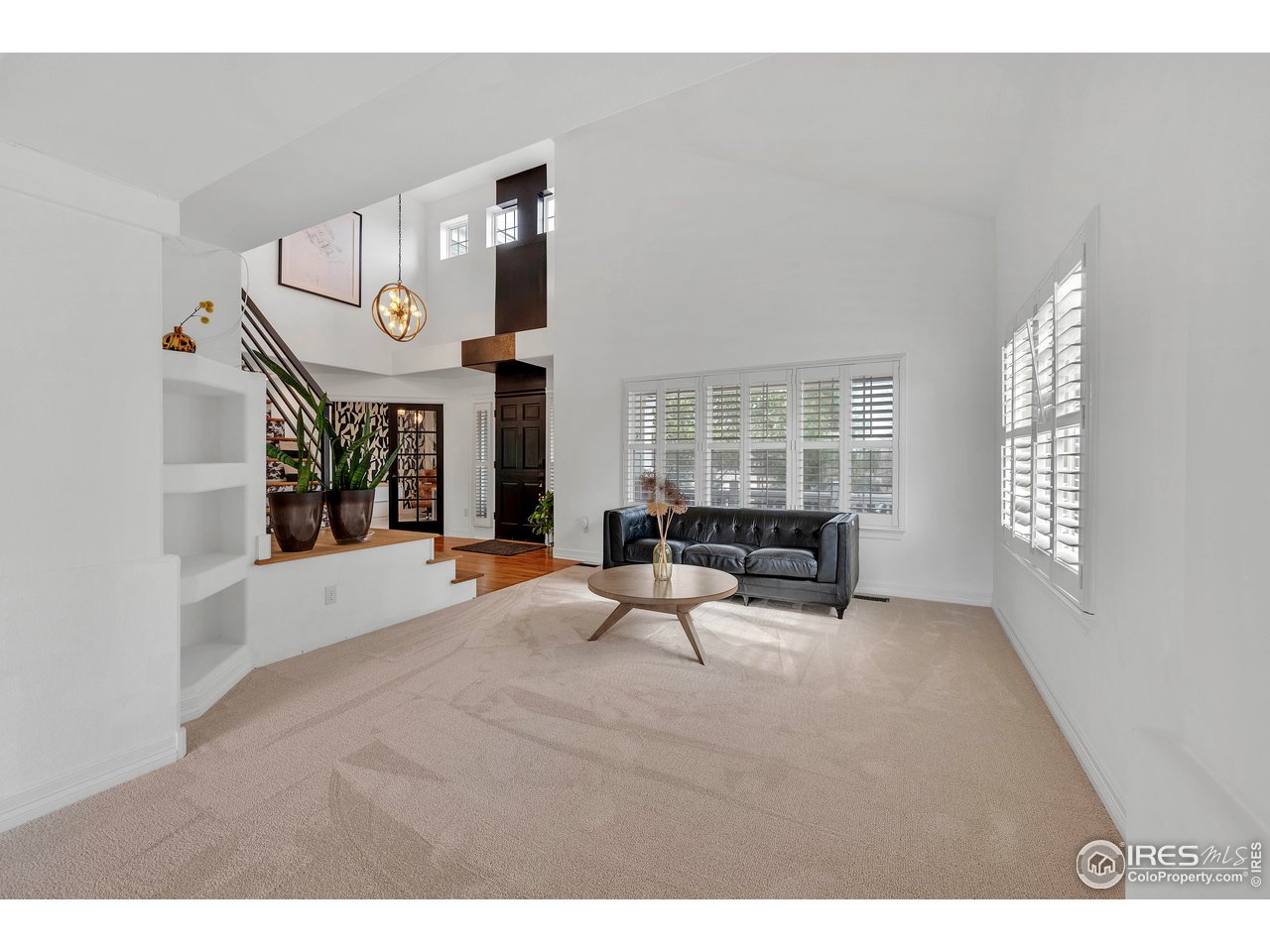 3058 West 111th Drive Westminster, CO 80031 - Photo 6 of 39 a living room with furniture and a window