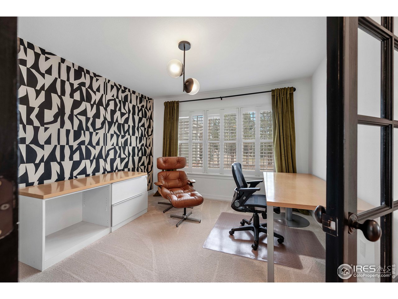 3058 West 111th Drive Westminster, CO 80031 - Photo 8 of 39 a living room with furniture and a large window