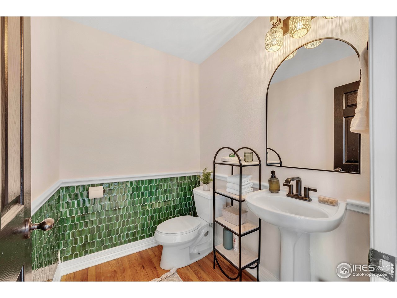 3058 West 111th Drive Westminster, CO 80031 - Photo 9 of 39 a bathroom with a sink a toilet and mirror
