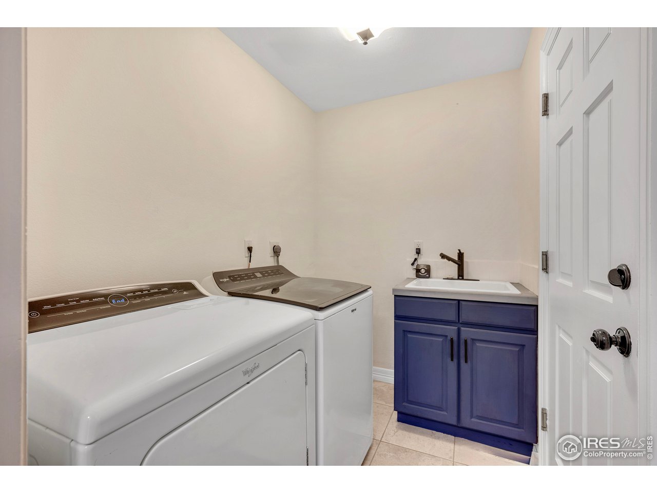 3058 West 111th Drive Westminster, CO 80031 - Photo 10 of 39 a utility room with dryer and washer