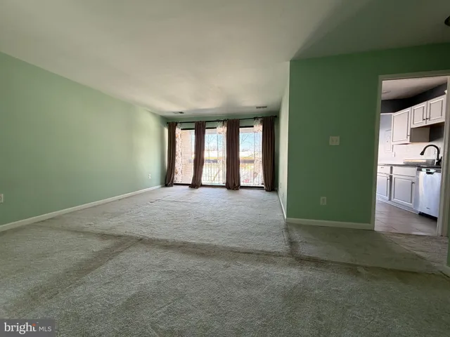 an empty room with windows and view