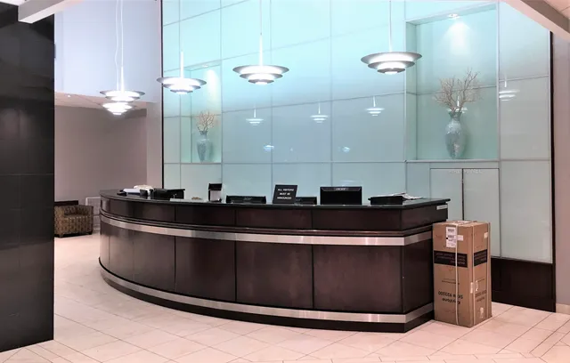a large kitchen with a sink and cabinets