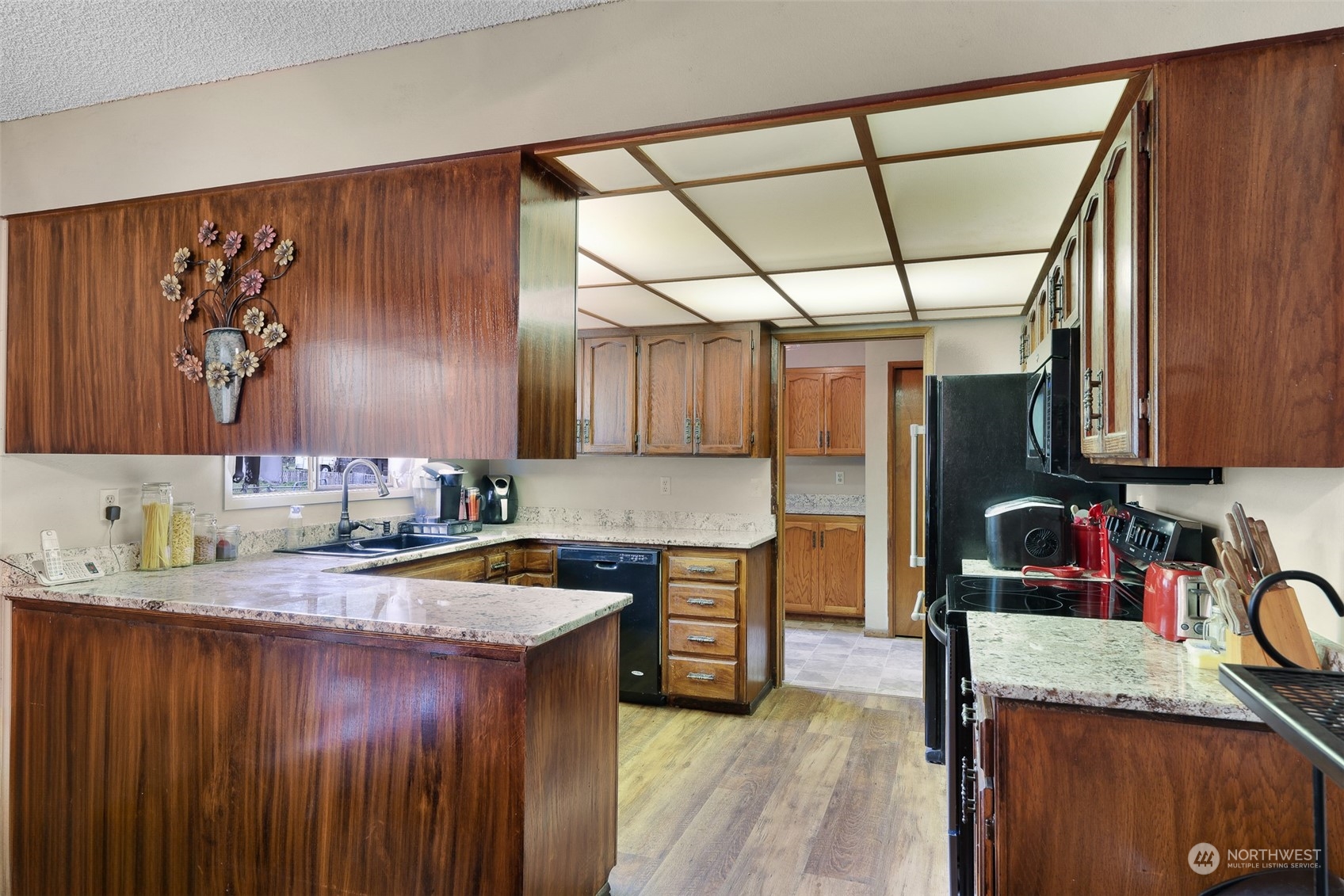 8665 Kendall Road Maple Falls, WA 98266 - Photo 13 of 40 a kitchen with a sink stove and cabinets