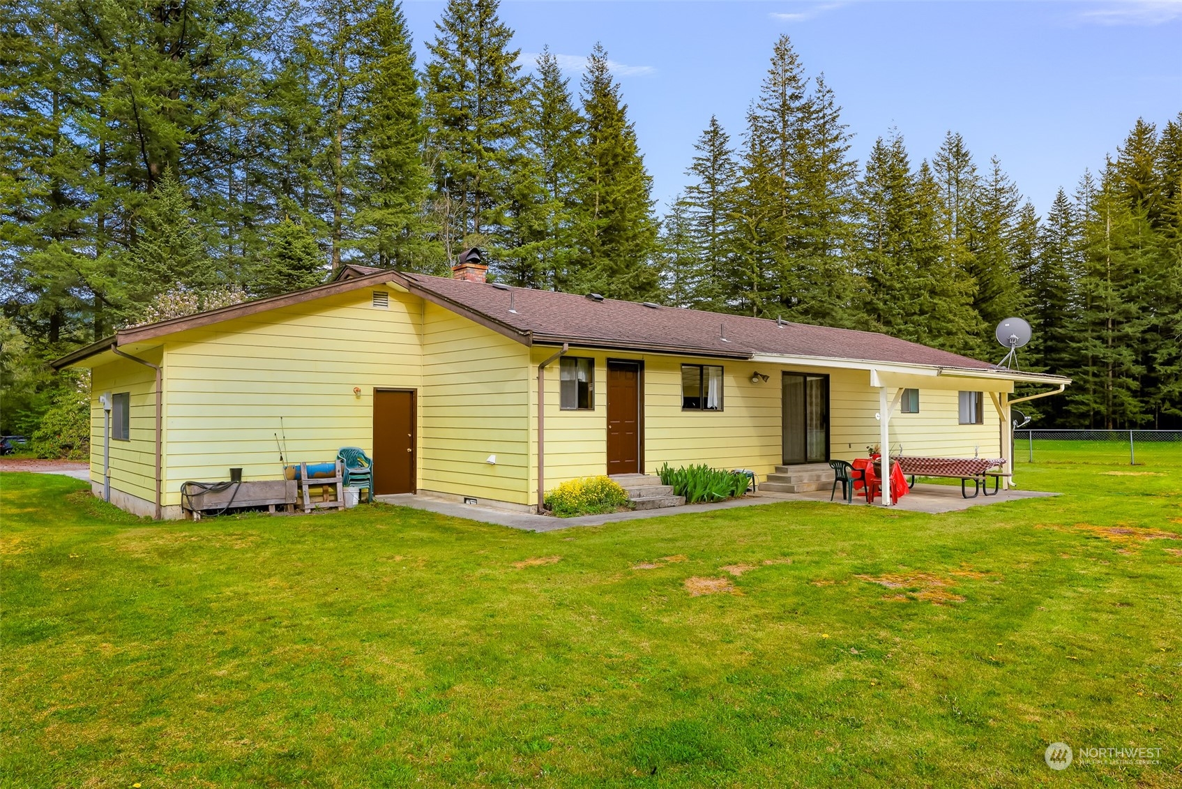 8665 Kendall Road Maple Falls, WA 98266 - Photo 31 of 40 a view of a house with a yard and deck