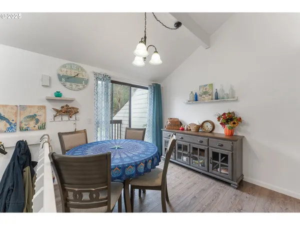 a dining room with furniture and wooden floor
