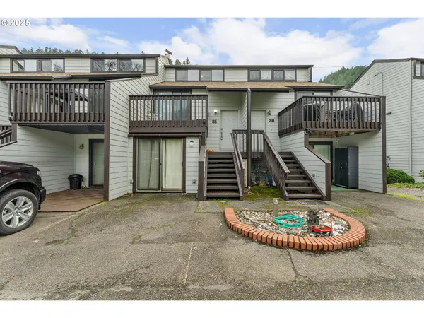 a view of a house with a sink and a wooden fence