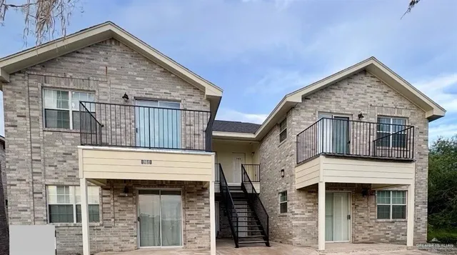 a view of small house with large windows