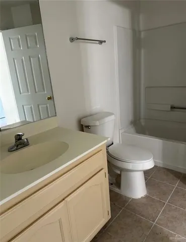 a bathroom with a toilet and a sink