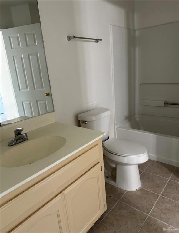 1521 Oasis Drive Mission, TX 78572 - Photo 12 of 18 a bathroom with a toilet and a sink