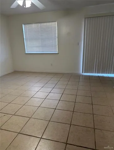 a view of an empty room and a window