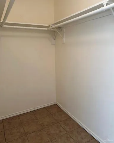 a view of an empty walk in closet